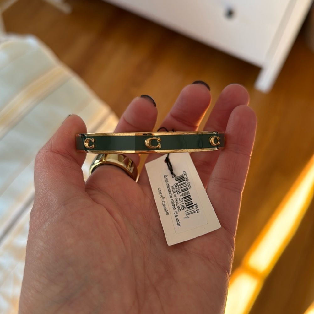 NWT Coach bracelet in green with gold C’s